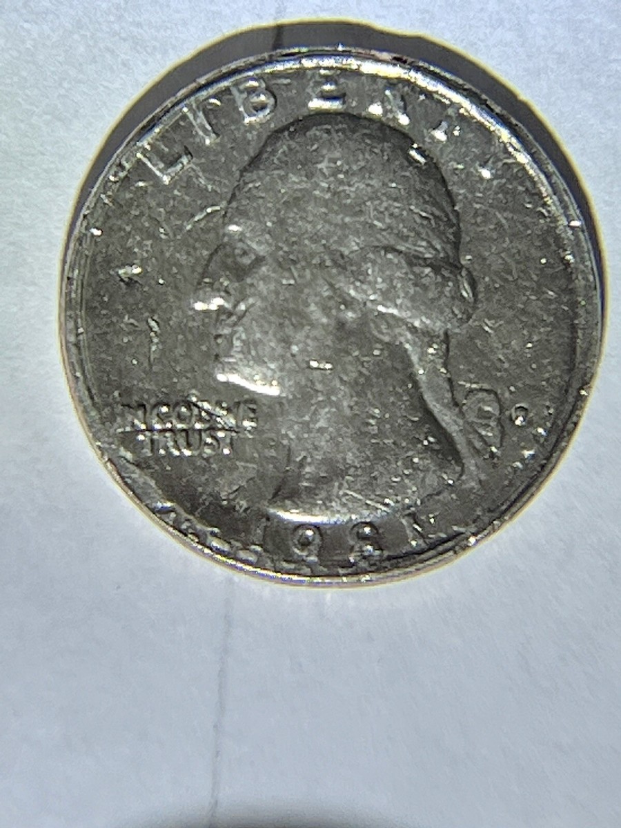 1981 Washington quarter off-center strike error showing Washington portrait shifted with crescent blank area and visible date
