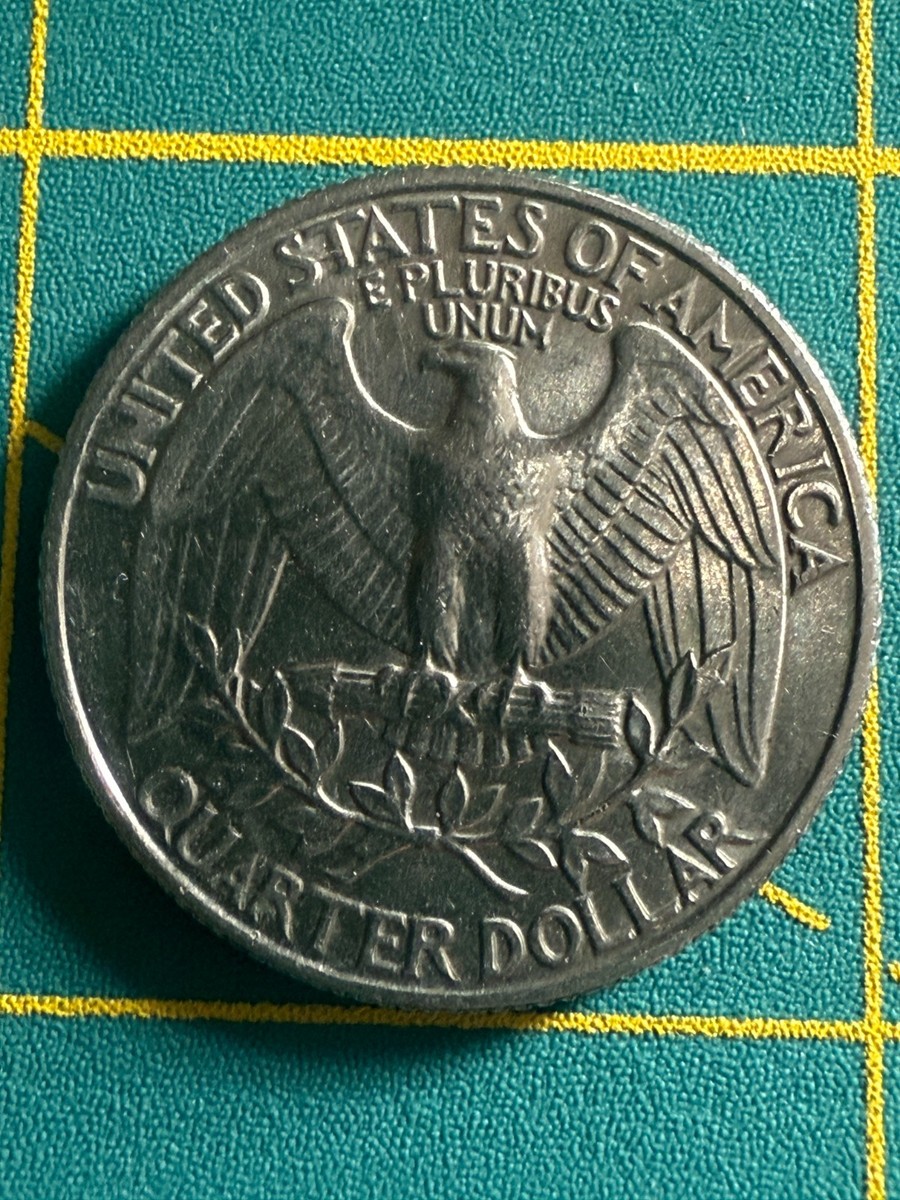1981 Washington quarter doubled die reverse error showing doubling on E PLURIBUS UNUM and eagle feathers under magnification